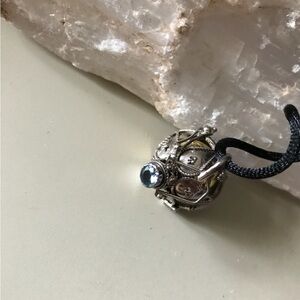 Elegant Silver and Harmony Ball Pendant